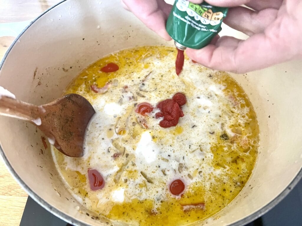 Tomato paste adding to curry