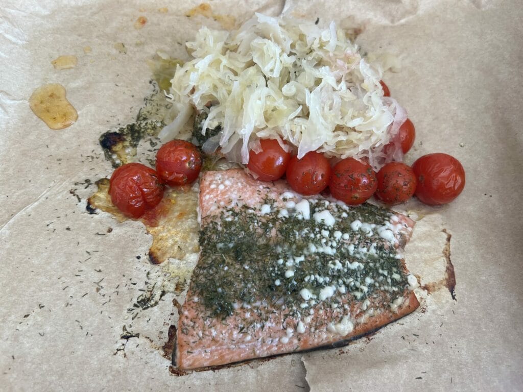 Grilled wild Salmon with Sauerkraut and cherry tomatoes